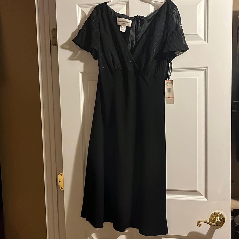 Black party dress. Never worn with tags .